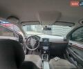 Черный Опель Астра, объемом двигателя 1.6 л и пробегом 236 тыс. км за 5000 $, фото 4 на Automoto.ua