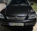 Черный Опель Астра, объемом двигателя 1.6 л и пробегом 232 тыс. км за 3900 $, фото 1 на Automoto.ua