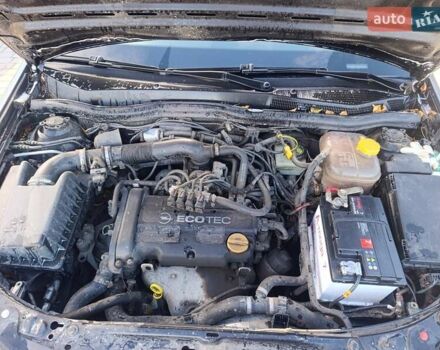 Черный Опель Астра, объемом двигателя 1.4 л и пробегом 250 тыс. км за 4000 $, фото 7 на Automoto.ua