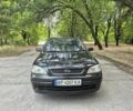 Черный Опель Астра, объемом двигателя 1.6 л и пробегом 201 тыс. км за 2800 $, фото 1 на Automoto.ua