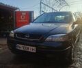 Черный Опель Астра, объемом двигателя 1.8 л и пробегом 330 тыс. км за 3400 $, фото 1 на Automoto.ua