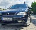Черный Опель Астра, объемом двигателя 1.6 л и пробегом 245 тыс. км за 5000 $, фото 1 на Automoto.ua