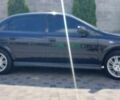 Черный Опель Астра, объемом двигателя 1.6 л и пробегом 245 тыс. км за 5000 $, фото 7 на Automoto.ua