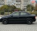 Черный Опель Астра, объемом двигателя 1.4 л и пробегом 205 тыс. км за 3800 $, фото 1 на Automoto.ua
