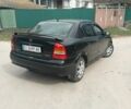 Черный Опель Астра, объемом двигателя 1.4 л и пробегом 270 тыс. км за 3200 $, фото 3 на Automoto.ua