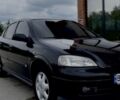 Черный Опель Астра, объемом двигателя 1.6 л и пробегом 230 тыс. км за 3600 $, фото 1 на Automoto.ua