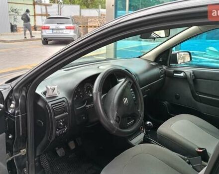 Черный Опель Астра, объемом двигателя 1.36 л и пробегом 291 тыс. км за 4000 $, фото 12 на Automoto.ua