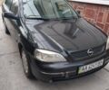 Черный Опель Астра, объемом двигателя 1.4 л и пробегом 220 тыс. км за 2800 $, фото 1 на Automoto.ua