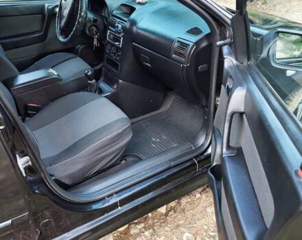 Черный Опель Астра, объемом двигателя 1.4 л и пробегом 320 тыс. км за 3750 $, фото 4 на Automoto.ua