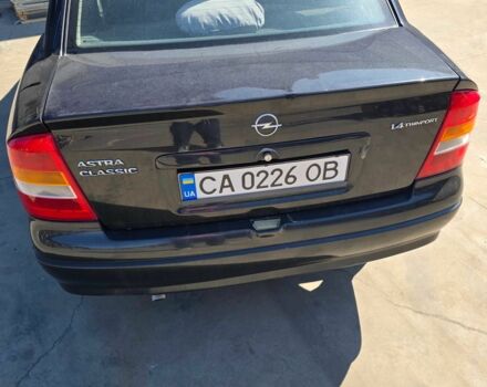 Черный Опель Астра, объемом двигателя 1.4 л и пробегом 240 тыс. км за 3000 $, фото 2 на Automoto.ua