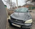 Черный Опель Астра, объемом двигателя 1.4 л и пробегом 210 тыс. км за 1500 $, фото 1 на Automoto.ua