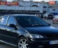 Черный Опель Астра, объемом двигателя 1.4 л и пробегом 185 тыс. км за 3200 $, фото 1 на Automoto.ua
