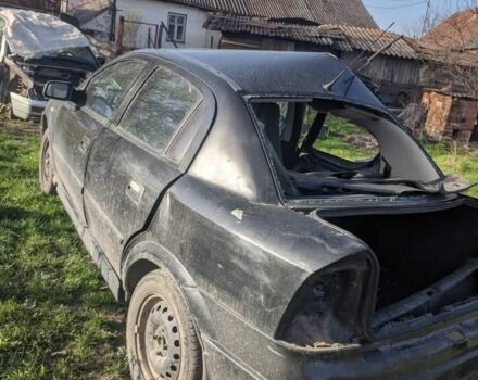 Черный Опель Астра, объемом двигателя 1 л и пробегом 290 тыс. км за 400 $, фото 1 на Automoto.ua