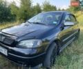 Черный Опель Астра, объемом двигателя 1.4 л и пробегом 294 тыс. км за 3600 $, фото 1 на Automoto.ua