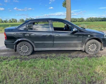 Черный Опель Астра, объемом двигателя 1.4 л и пробегом 294 тыс. км за 3800 $, фото 2 на Automoto.ua