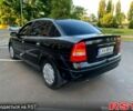 Черный Опель Астра, объемом двигателя 1.4 л и пробегом 270 тыс. км за 1750 $, фото 1 на Automoto.ua