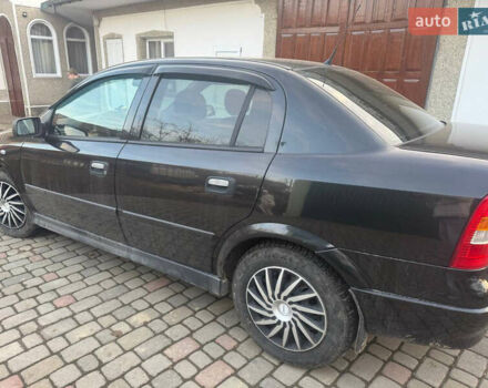 Черный Опель Астра, объемом двигателя 1.4 л и пробегом 210 тыс. км за 3300 $, фото 7 на Automoto.ua
