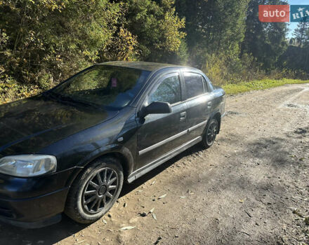 Черный Опель Астра, объемом двигателя 1.4 л и пробегом 230 тыс. км за 2100 $, фото 2 на Automoto.ua