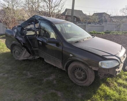 Черный Опель Астра, объемом двигателя 1 л и пробегом 290 тыс. км за 400 $, фото 2 на Automoto.ua