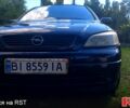 Черный Опель Астра, объемом двигателя 1.4 л и пробегом 235 тыс. км за 3300 $, фото 1 на Automoto.ua