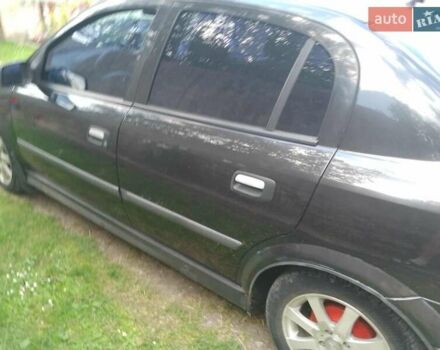 Черный Опель Астра, объемом двигателя 1.4 л и пробегом 243 тыс. км за 3200 $, фото 5 на Automoto.ua