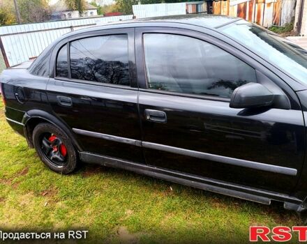 Черный Опель Астра, объемом двигателя 1.4 л и пробегом 412 тыс. км за 3100 $, фото 1 на Automoto.ua