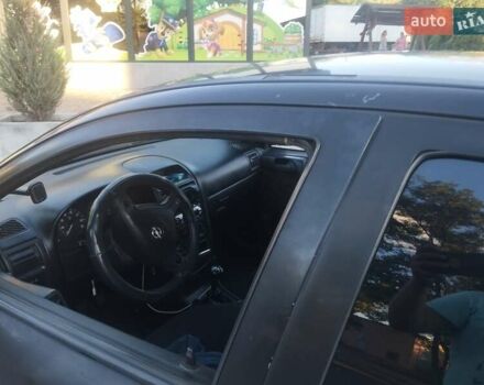 Черный Опель Астра, объемом двигателя 1.36 л и пробегом 330 тыс. км за 3600 $, фото 5 на Automoto.ua