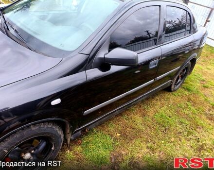 Черный Опель Астра, объемом двигателя 1.4 л и пробегом 412 тыс. км за 3100 $, фото 3 на Automoto.ua