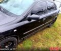 Черный Опель Астра, объемом двигателя 1.4 л и пробегом 412 тыс. км за 3100 $, фото 3 на Automoto.ua