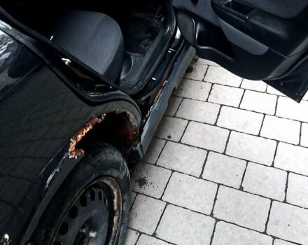 Черный Опель Астра, объемом двигателя 1.39 л и пробегом 214 тыс. км за 1800 $, фото 18 на Automoto.ua