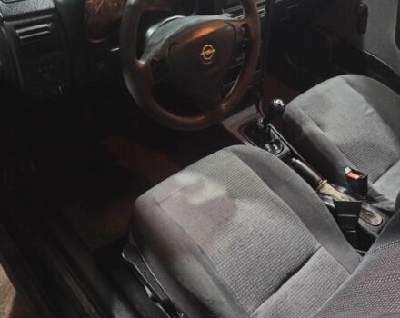 Черный Опель Астра, объемом двигателя 1.4 л и пробегом 282 тыс. км за 2000 $, фото 4 на Automoto.ua