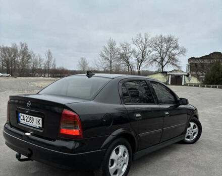 Черный Опель Астра, объемом двигателя 2 л и пробегом 300 тыс. км за 3800 $, фото 3 на Automoto.ua