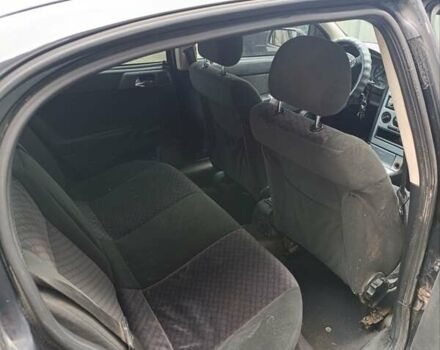 Черный Опель Астра, объемом двигателя 1.6 л и пробегом 147 тыс. км за 2700 $, фото 6 на Automoto.ua