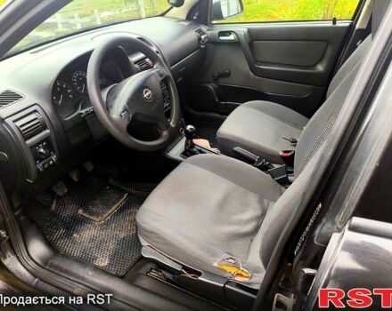 Черный Опель Астра, объемом двигателя 1.4 л и пробегом 412 тыс. км за 3100 $, фото 6 на Automoto.ua