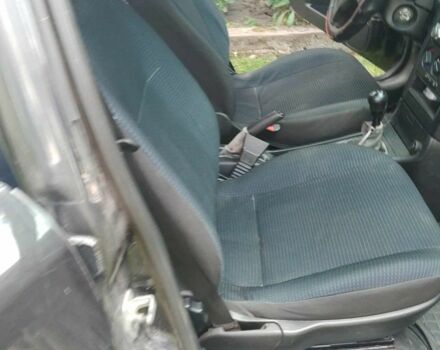 Черный Опель Астра, объемом двигателя 1.4 л и пробегом 243 тыс. км за 3200 $, фото 4 на Automoto.ua