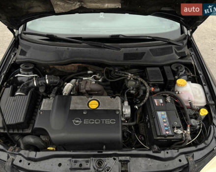 Черный Опель Астра, объемом двигателя 2 л и пробегом 300 тыс. км за 3800 $, фото 11 на Automoto.ua