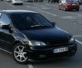 Черный Опель Астра, объемом двигателя 1.4 л и пробегом 185 тыс. км за 3000 $, фото 2 на Automoto.ua