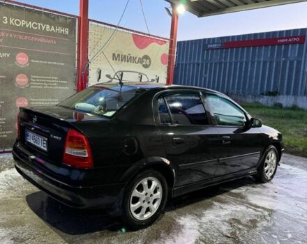 Черный Опель Астра, объемом двигателя 1.4 л и пробегом 215 тыс. км за 3500 $, фото 4 на Automoto.ua