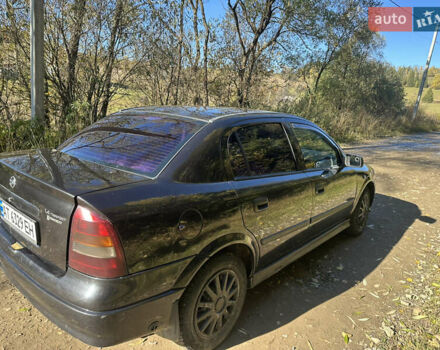 Черный Опель Астра, объемом двигателя 1.4 л и пробегом 230 тыс. км за 2100 $, фото 4 на Automoto.ua