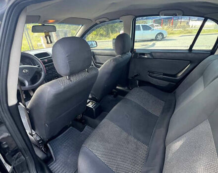 Черный Опель Астра, объемом двигателя 1.4 л и пробегом 290 тыс. км за 2700 $, фото 37 на Automoto.ua