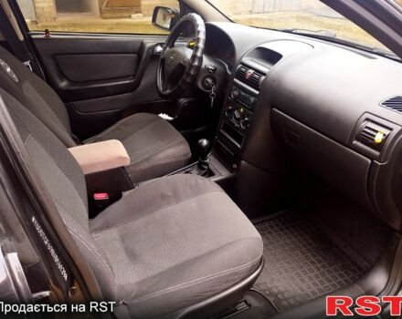 Черный Опель Астра, объемом двигателя 1.4 л и пробегом 250 тыс. км за 3999 $, фото 8 на Automoto.ua