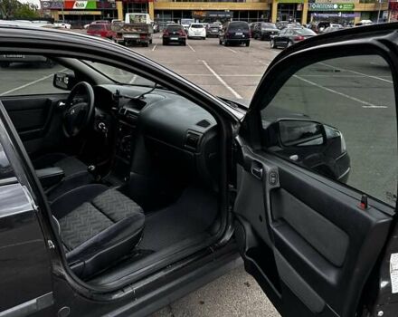 Черный Опель Астра, объемом двигателя 1.4 л и пробегом 277 тыс. км за 3300 $, фото 14 на Automoto.ua