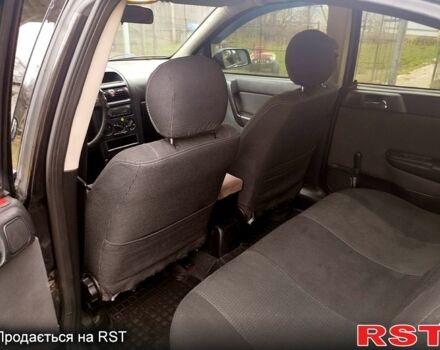 Черный Опель Астра, объемом двигателя 1.4 л и пробегом 250 тыс. км за 3999 $, фото 10 на Automoto.ua