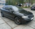 Черный Опель Астра, объемом двигателя 1.4 л и пробегом 178 тыс. км за 3816 $, фото 1 на Automoto.ua