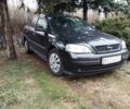Черный Опель Астра, объемом двигателя 2 л и пробегом 225 тыс. км за 2500 $, фото 1 на Automoto.ua