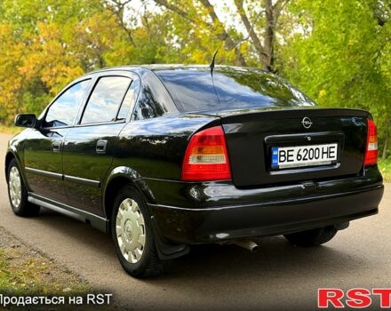 Черный Опель Астра, объемом двигателя 1.4 л и пробегом 250 тыс. км за 4000 $, фото 4 на Automoto.ua