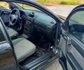 Черный Опель Астра, объемом двигателя 1.6 л и пробегом 179 тыс. км за 5000 $, фото 2 на Automoto.ua