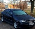 Черный Опель Астра, объемом двигателя 1.6 л и пробегом 210 тыс. км за 3100 $, фото 1 на Automoto.ua