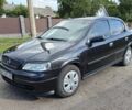 Черный Опель Астра, объемом двигателя 1.6 л и пробегом 180 тыс. км за 3494 $, фото 1 на Automoto.ua