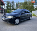 Черный Опель Астра, объемом двигателя 1.4 л и пробегом 175 тыс. км за 4300 $, фото 1 на Automoto.ua